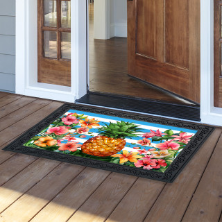 Pineapple and Stripes Doormat with colorful floral design and black border on wooden porch floor.