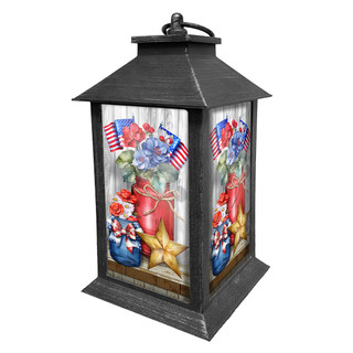 American Flowers Lantern with patriotic floral design, stars, and flags on a distressed black metal base.