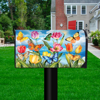 Sunshine Butterflies Oversized Mailbox Cover with colorful butterflies and tulips on a black mailbox post outdoors.