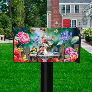 Spring Bath Birds Oversized colorful mailbox cover with vibrant floral design and birds on a post.