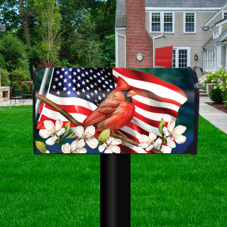 American Cardinal Oversized Mailbox Cover with USA flag design and white flowers on black post.