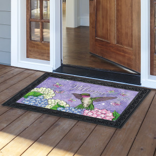 Hummingbird and Hydrangea doormat with purple background, colorful flowers, and hummingbird design, black border.