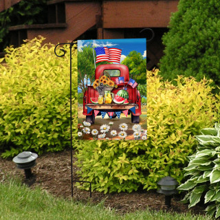 American Pickup Picnic Garden Flag with red truck, flowers, and American flag design outdoors.