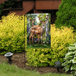 Deer in Forest Garden Flag with two brown deer in a woodland setting on a garden stand.