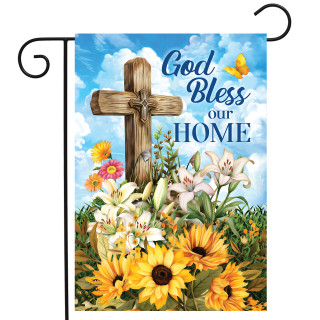 God Bless Our Home garden flag with cross, flowers, and butterfly on blue cloudy background displayed.