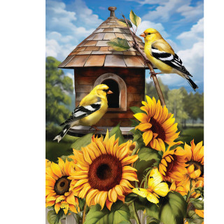 Goldfinches perched on and near a birdhouse surrounded by bright sunflowers on a garden flag.