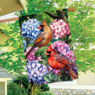 Perched Cardinals House Flag with vibrant purple flowers and two cardinals on a garden background.