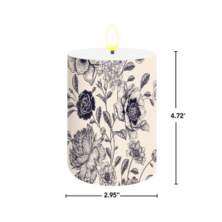 Woodcut Floral Flameless Candle, beige with black floral design, 2.95" wide, 4.72" tall.