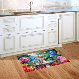 Spring Bath Birds Doormat on wooden floor in front of white kitchen cabinets and sink area.