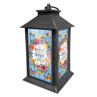 Bless This Home With Love Lantern, black metal lantern with floral design and butterfly accents.