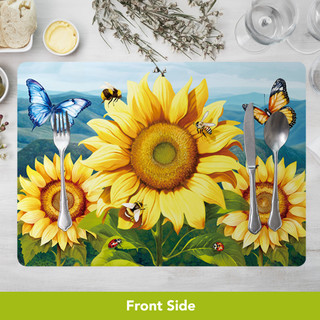 Sunflower Dance Placemat with butterflies, bees, and sunflowers, silverware on a vibrant placemat surface.
