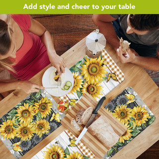 Elegant sunflower placemats on wooden table with food and people, four pack yellow flower design.