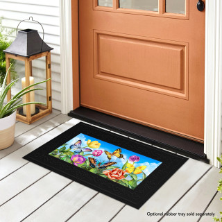Black mini doormat with colorful butterflies and tulips design, placed on a porch floor.