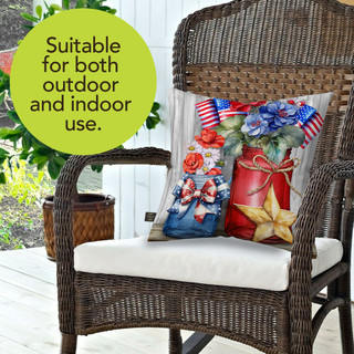 American Flowers Indoor/Outdoor Pillow, brown wicker chair with white cushion and floral throw pillows.