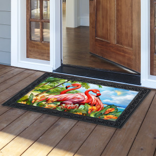 Flamingo Pair Doormat with colorful flamingos, green leaves, and blue sky on a black background.