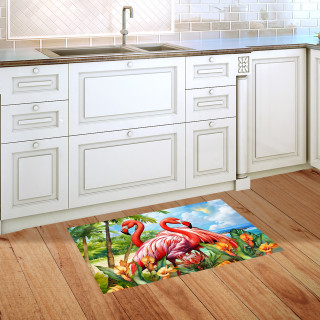 Flamingo pair design doormat on wooden floor in front of white kitchen cabinets and sink area.