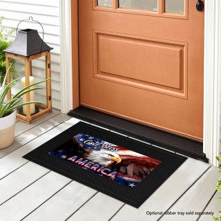 Black mini doormat with eagle and God Bless America text on a front porch entrance.