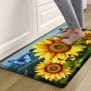 Sunflower Dance Comfort Mat with vibrant yellow sunflowers, blue butterfly and green leaves design on floor.