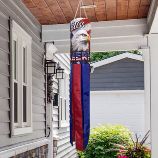 God Bless America Eagle windsock with red and blue stripes and white eagle design hanging outdoors.
