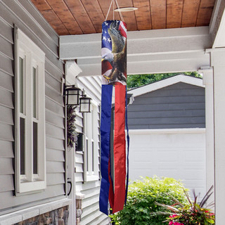 American Freedom Eagle Windsock Wind Twister hanging from a porch with red, white, and blue design.