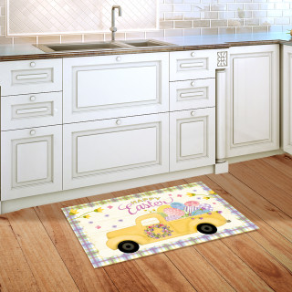 Happy Easter Pickup doormat on wooden floor in front of white kitchen cabinets and sink.