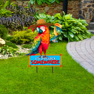 Vibrant red, green, and blue macaw parrot on metal art sign with sombrero and garden background.