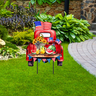 Red American Pickup Picnic Metal Art with patriotically decorated truck and picnic items on a lawn.