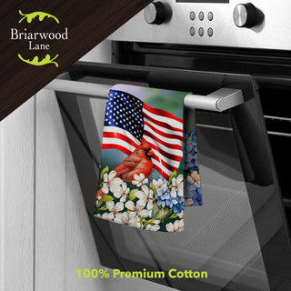 American Cardinal Cotton Hand Towel hanging on oven handle with floral and American flag design.