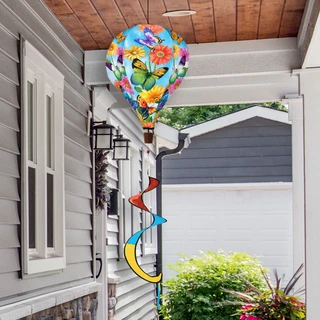 Colorful Fluttering Butterflies Hot Air Balloon Spinner with swirling tails outdoors near a house entrance.
