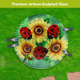 Ladybugs and Sunflowers artisan-sculpted glass birdbath with colorful ladybugs and sunflowers design on green base.