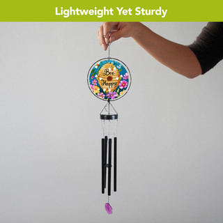 Happy Beehive Illuminated Wind Chime with colorful flowers and purple pendant, held by a hand.