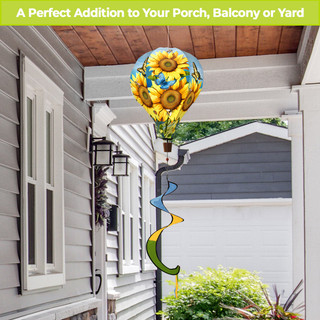 Sunflower Dance Hot Air Balloon Spinner with colorful spiral tail, mounted on a black pole outdoors.