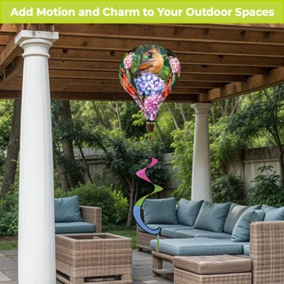 Perched Cardinals hot air balloon spinner hanging from a pergola amidst outdoor furniture and greenery.