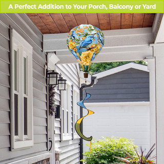 Bluebirds and Roses hot air balloon spinner with blue and yellow design on a black stand.