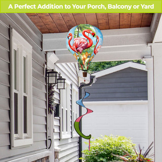 Flamingo Pair Hot Air Balloon Spinner with colorful spiral tail outdoors on a porch pole.