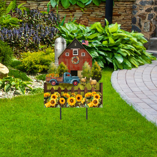 Sunflower Barn Metal Art garden decoration with red barn, blue truck, and sunflowers on green lawn.