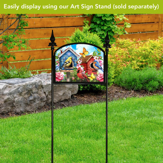 Floral Birdhouses Acrylic Art Sign with colorful birdhouses, flowers on a black garden sign stand outdoors.