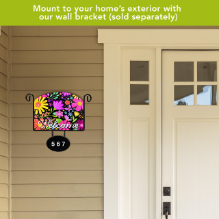 Spring Fling Acrylic Art Sign with colorful floral design and Welcome text on exterior wall bracket.