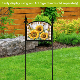 Sunflower Duo Acrylic Art Sign with Welcome text on a black metal garden stake outdoors.