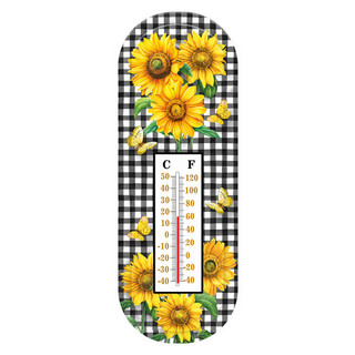 Checkered sunflowers metal thermometer with Celsius and Fahrenheit scale and yellow sunflowers on black and white background.