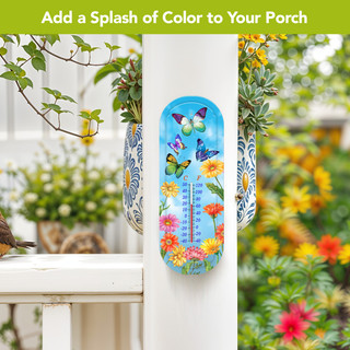 Fluttering Butterflies Metal Thermometer with colorful butterflies and flowers on a blue background outdoors.