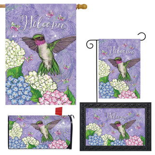 Hummingbird and Hydrangea Collection garden flags and pillow with purple background, green hummingbird, and flowers.