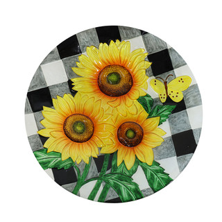 Round glass birdbath with checkered sunflowers and butterfly design on a black and white background.