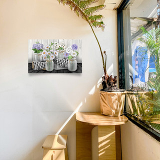 Large LED canvas art of checkered mason jars with flowers on a wooden shelf indoors.