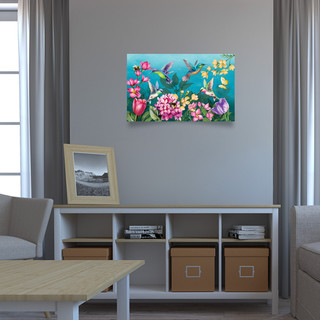 Springtime Hummingbirds Large LED Canvas Art with colorful flowers and hummingbirds on a living room wall.