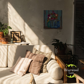 Farm Fresh Flowers Spring Large LED Canvas Art on a wall above a cream colored couch.