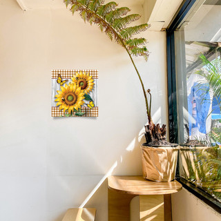Sunflower Duo Medium LED Canvas Art on wall with sunflowers and green checkered background displayed.