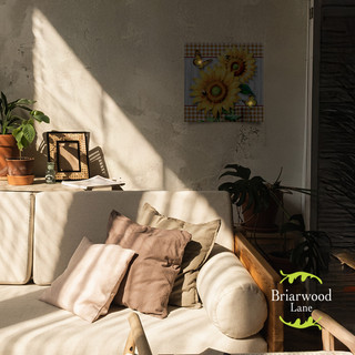 Briarwood Lane Sunflower Duo Medium LED Canvas Art on a living room wall with white couch.