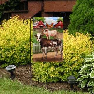 Farm Friends Garden Flag with cow, horse and butterfly design on a garden flag pole outdoors.