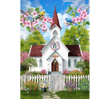 White church with red roof and steeple surrounded by flowers and picket fence in spring.